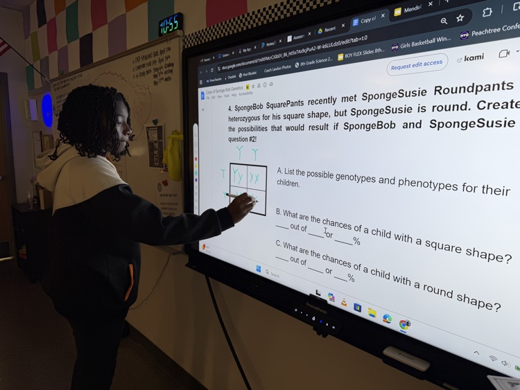 kids doing work at the board 