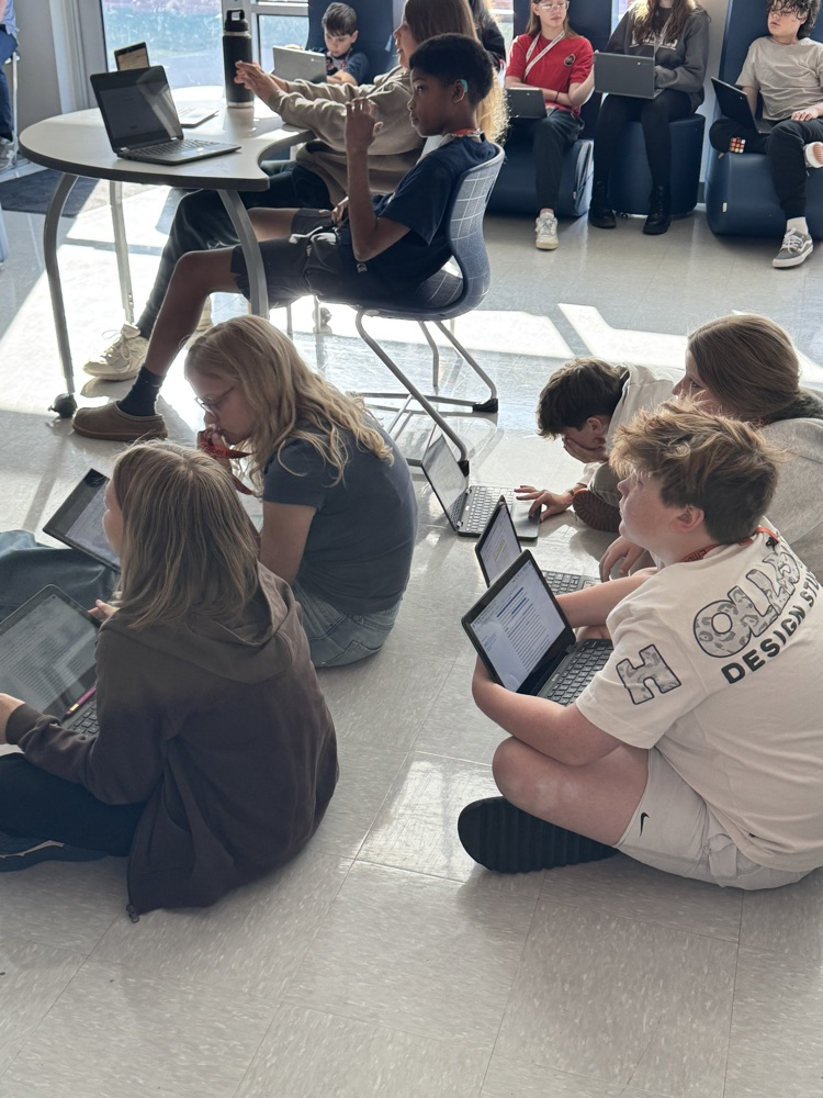 teacher with kids in collab room 
