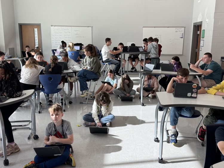 teacher with kids in collab room 