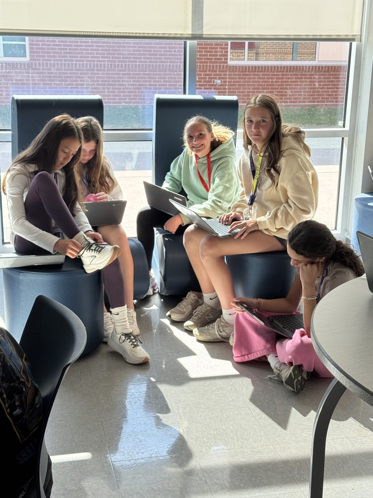 teacher with kids in collab room 