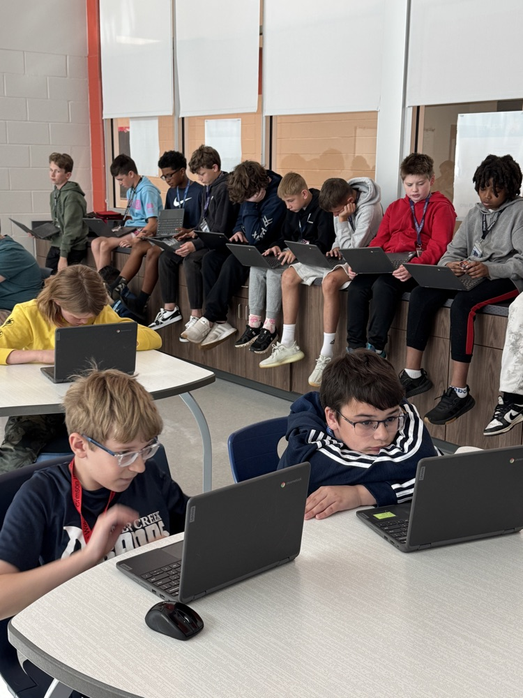 teacher with kids in collab room 