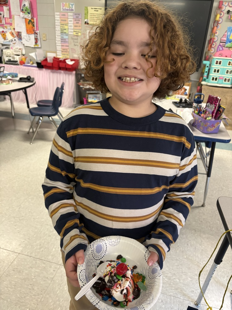 students making ice cream sundaes