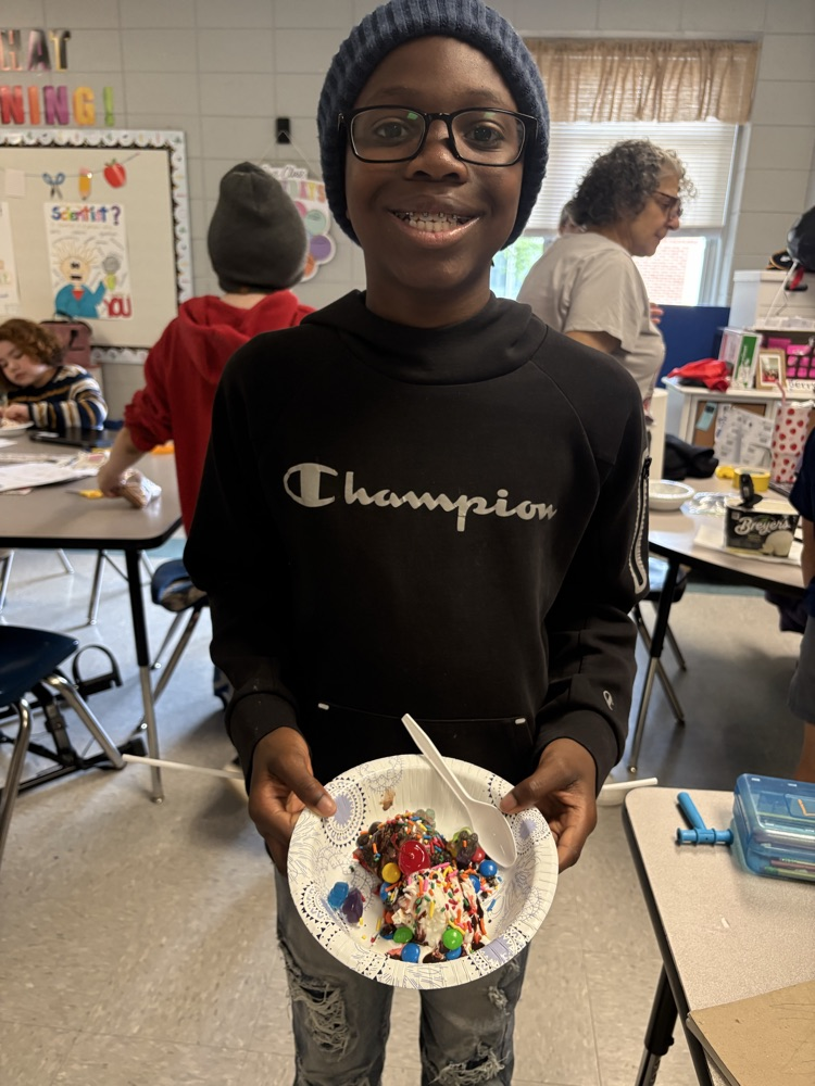 students making ice cream sundaes
