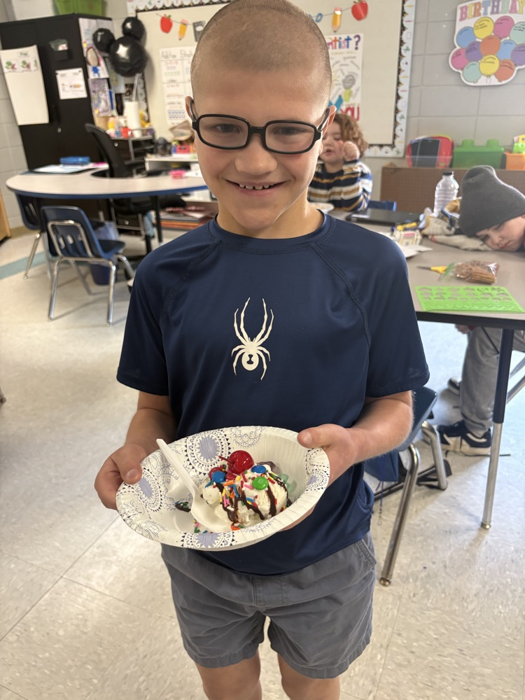 students making ice cream sundaes