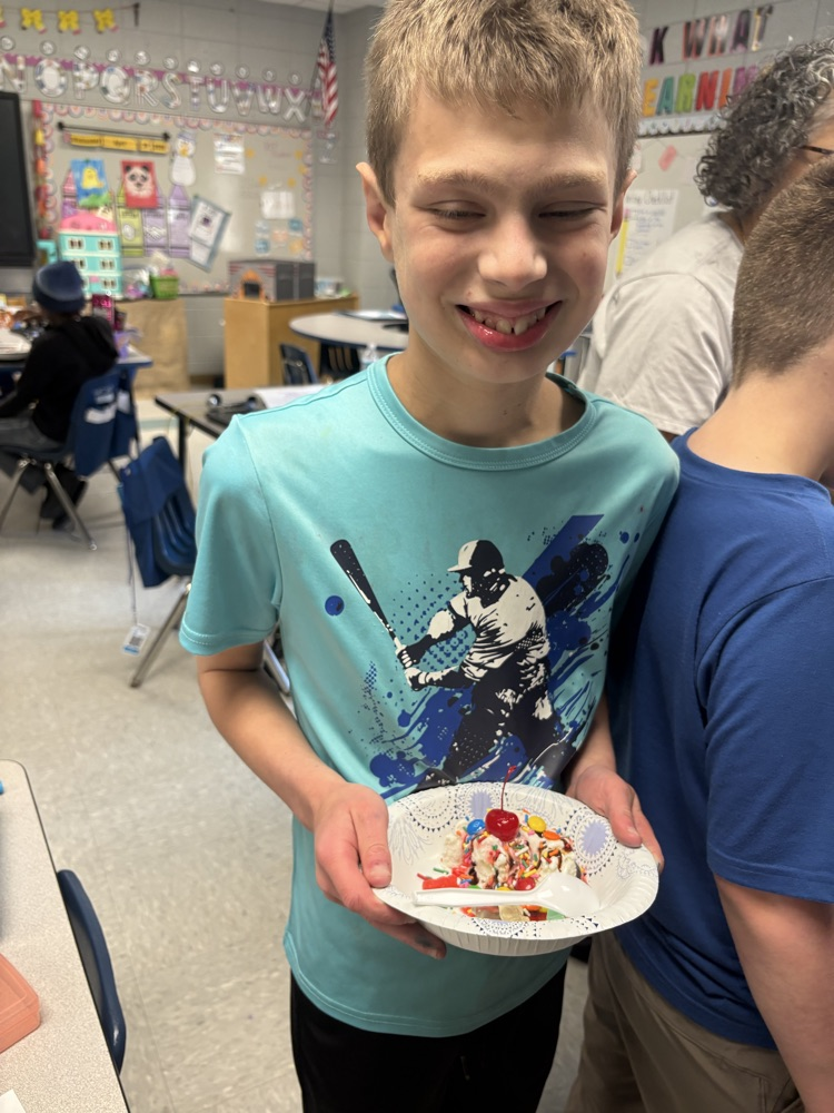 students making ice cream sundaes