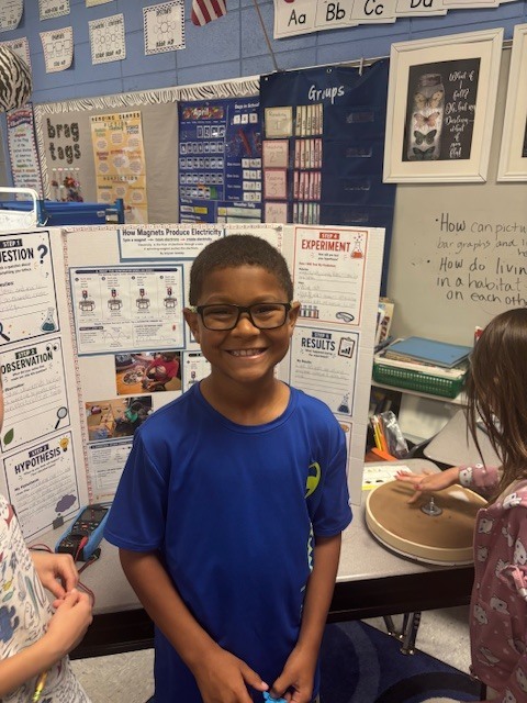 Today our friend Greyson taught our class about how magnets produce electricity. He explained the scientific method and did a complete presentation including lights that worked! Pretty impressive for second grade!