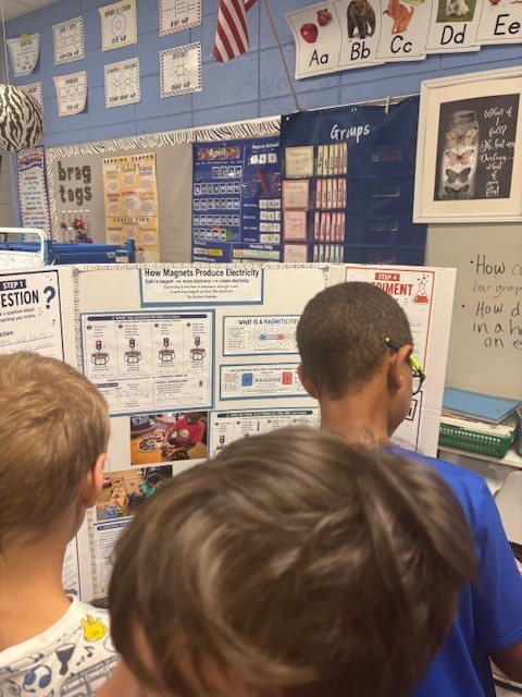 Today our friend Greyson taught our class about how magnets produce electricity. He explained the scientific method and did a complete presentation including lights that worked! Pretty impressive for second grade!