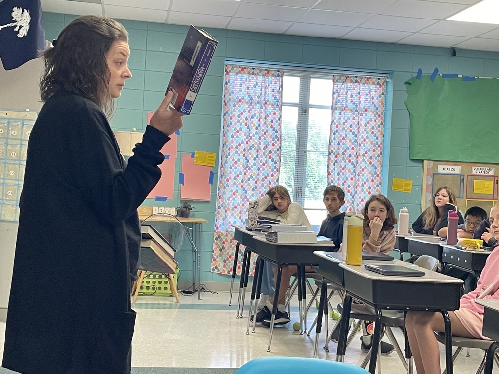 Mrs. Loggins sharing for First Chapter Friday in Mrs. Cobb's classroom