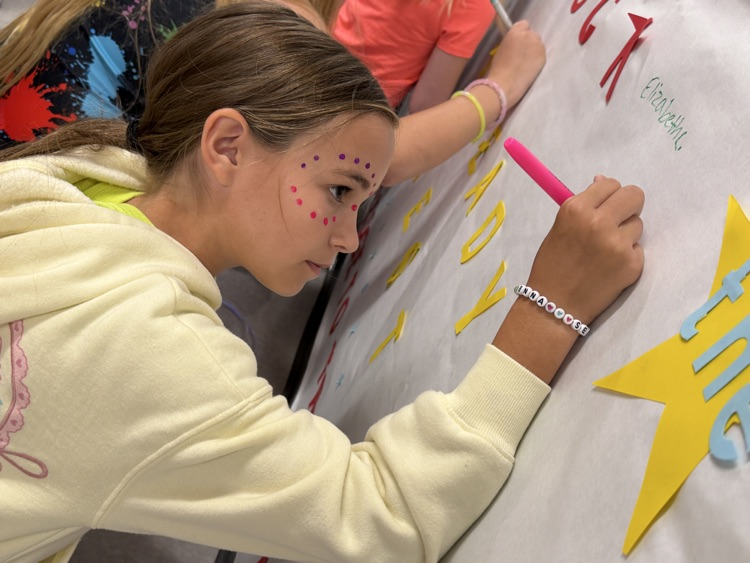 student signing pledge