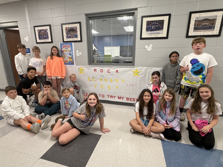 student sitting in front of signed pledge