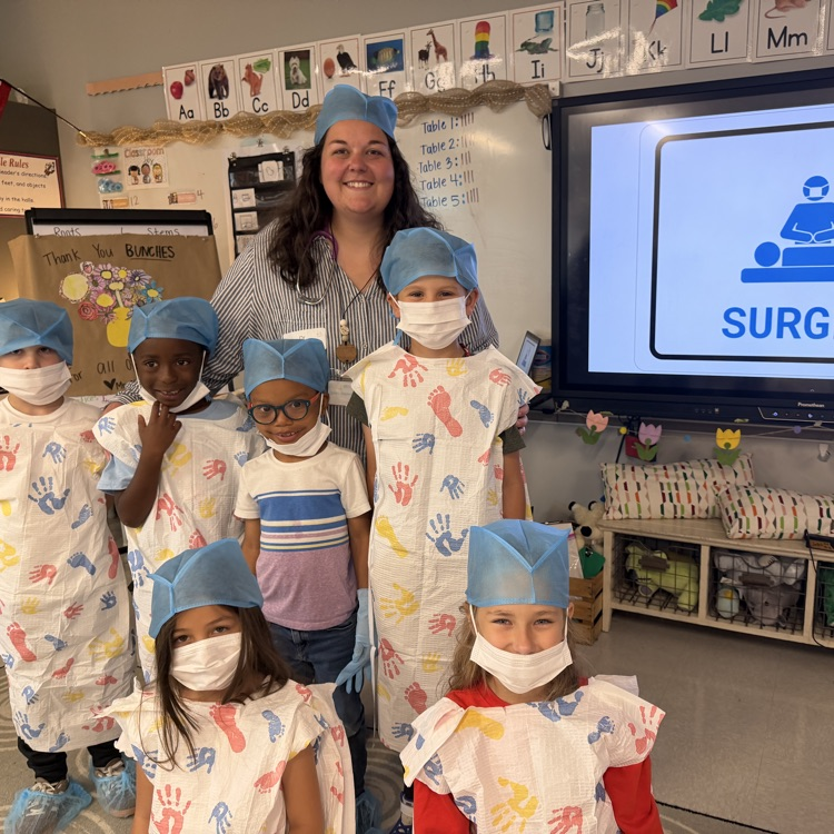 Students and teacher in operating gear