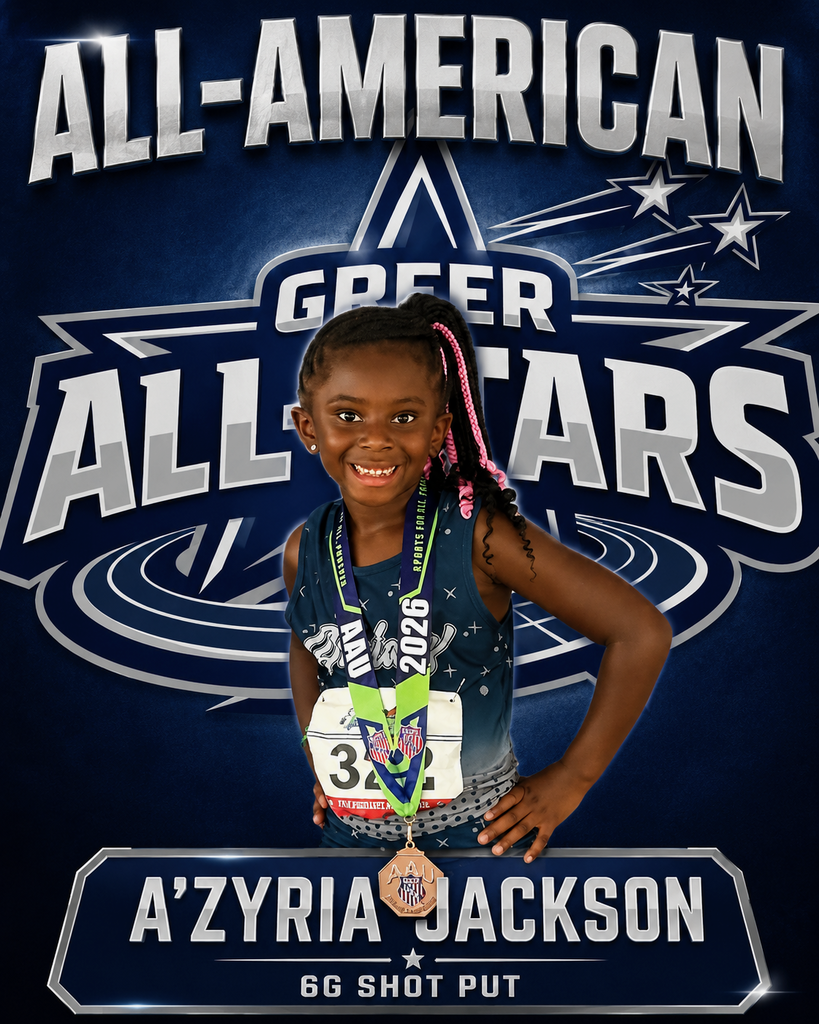 Student posing with medal 
