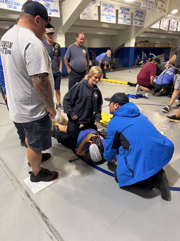 Firefighters working with trainers