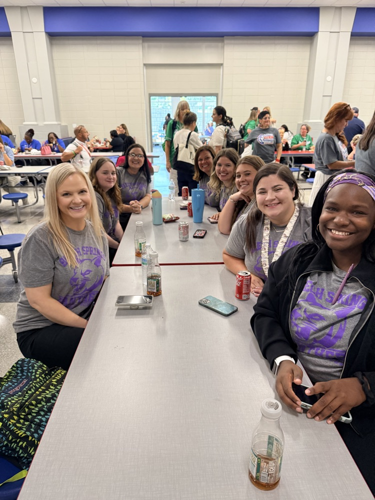 teachers smiling at a table