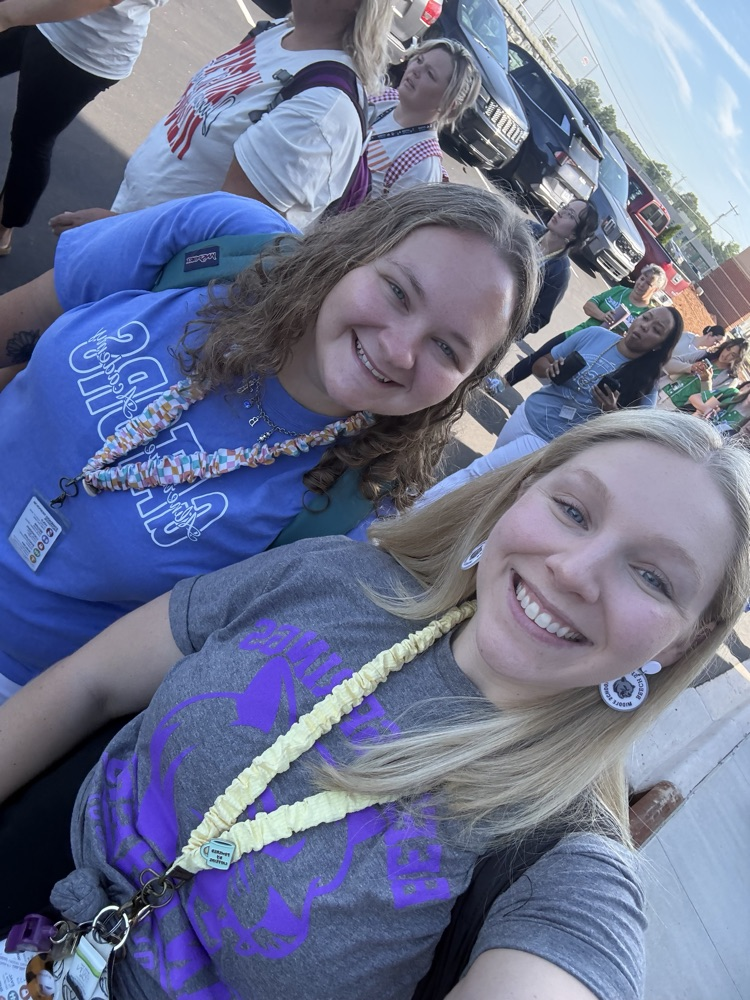 two teachers smiling