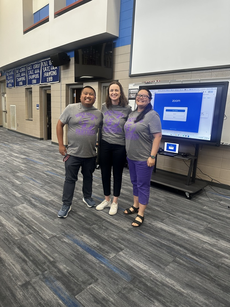 three teachers hugging