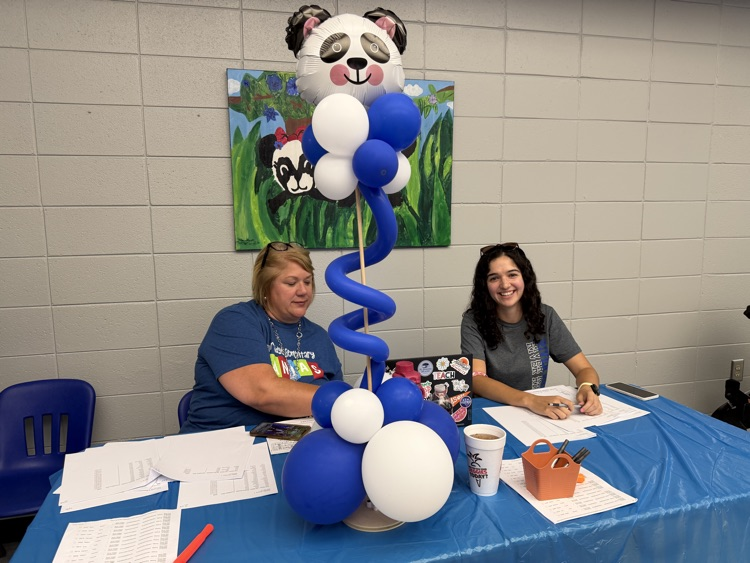 teachers helping families in the lobby