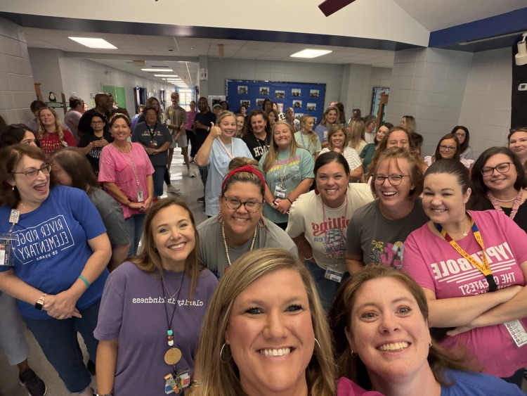 large group of smiling teachers 