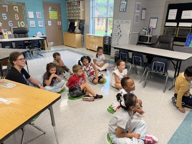 children working and playing in a classroom