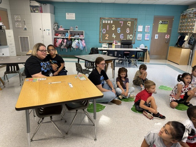 children working and playing in a classroom