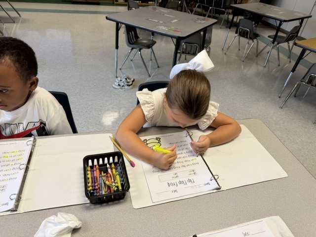 children working and playing in a classroom