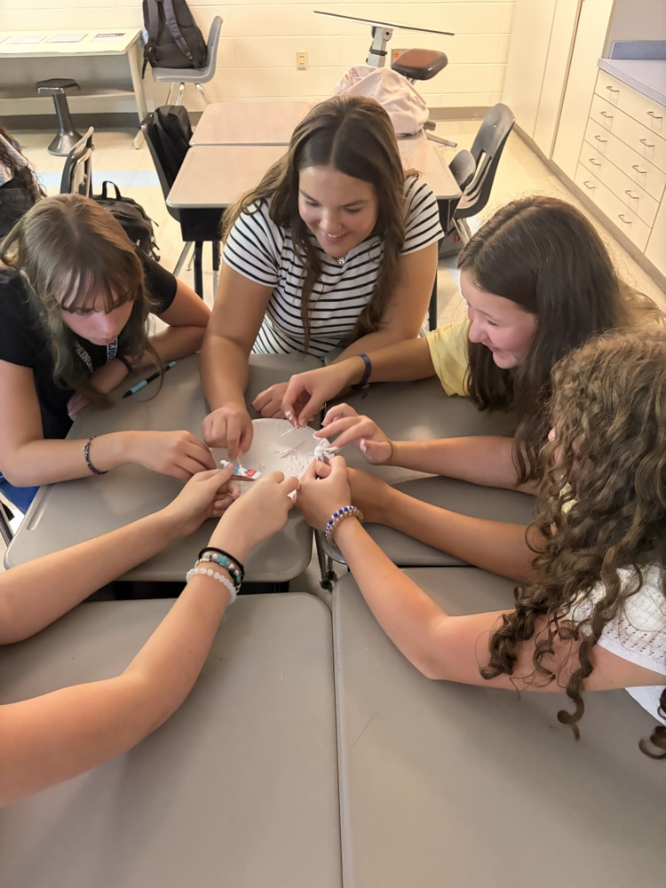 students working together with toothepaste