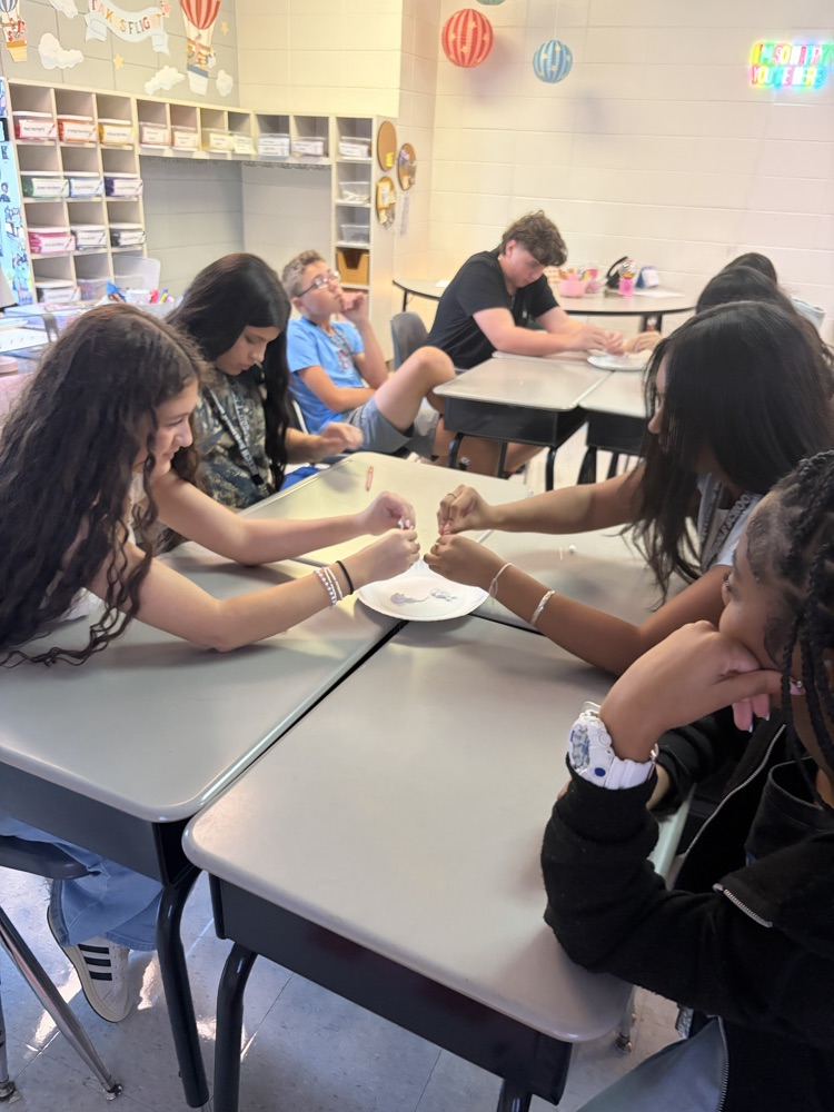 students working together with toothepaste