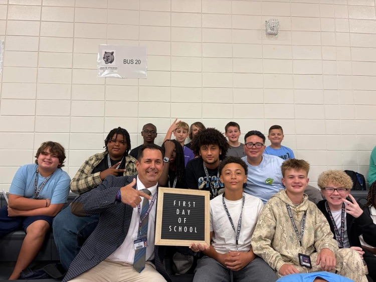 principal and students posing