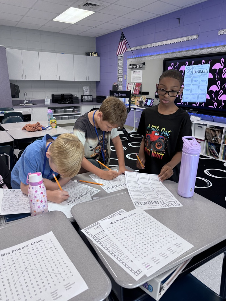 4th graders working together on a group project in the classroom