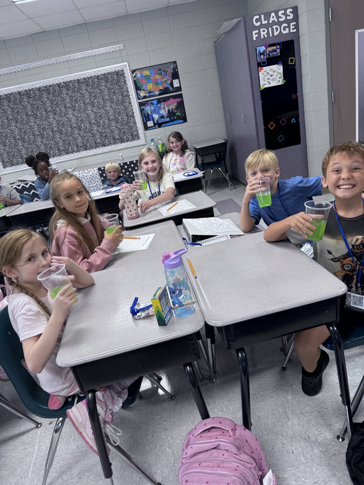 4th graders working together on a group project in the classroom