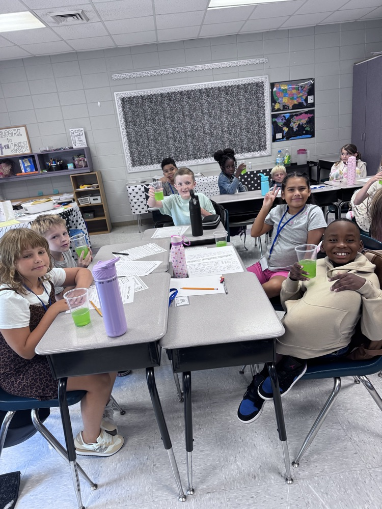 4th graders working together on a group project in the classroom