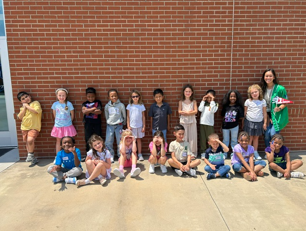 This image includes a picture of a class at TRE.