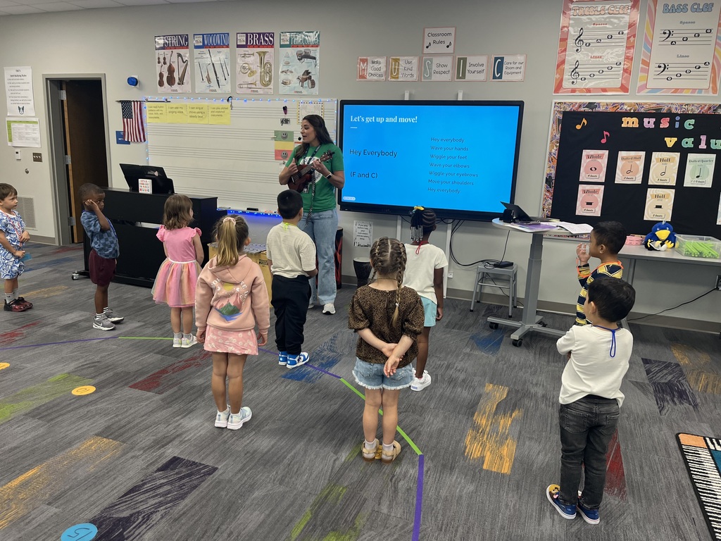 This picture includes Pre-K students in music class singing.