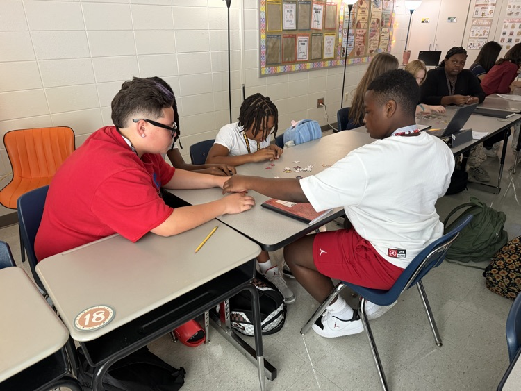 group of students working on a puzzle