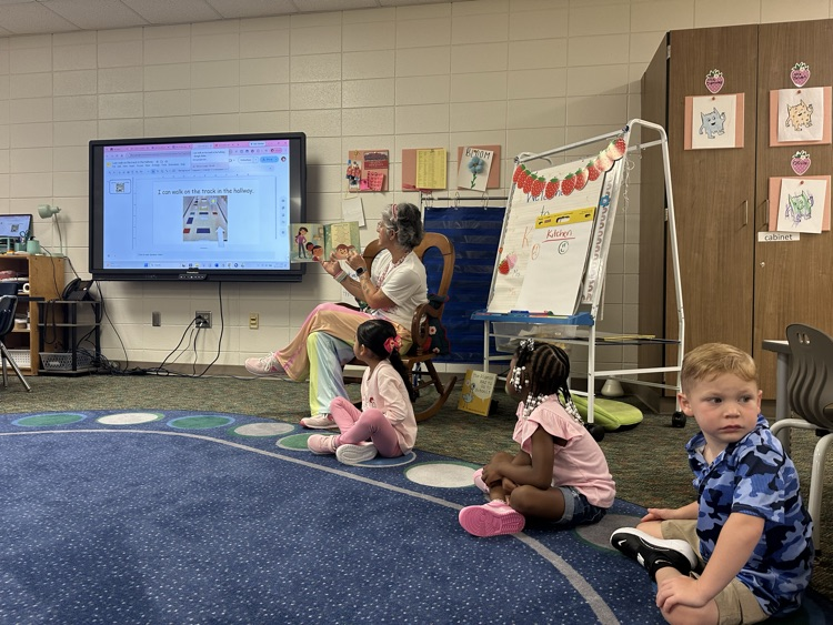 teacher reading to students