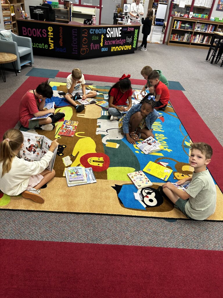 students in the library finding books