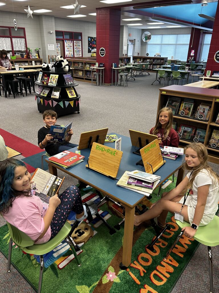 students in the library finding books