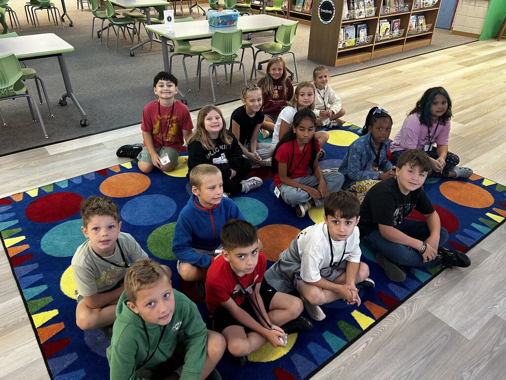 students in the library finding books