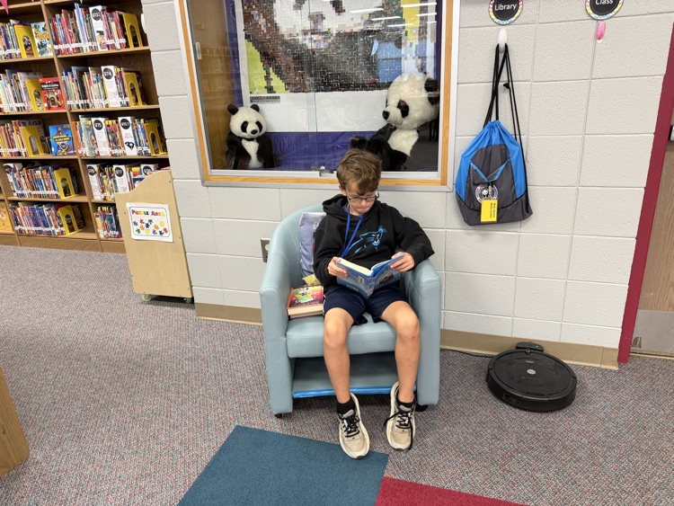 students reading in the library 