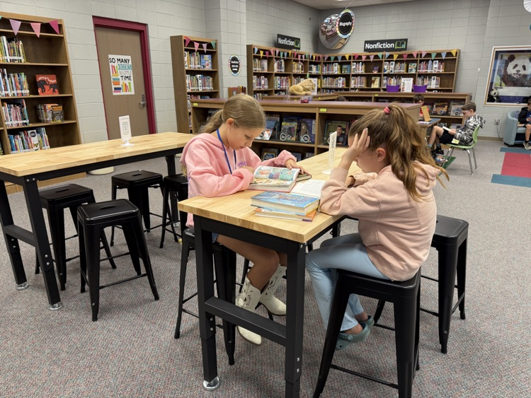students reading in the library 