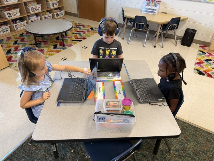 students learning how to use a computer