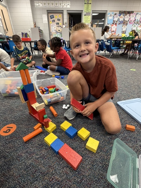 students building with blocks and STEM toys