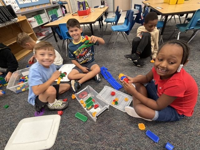 students building with blocks and STEM toys