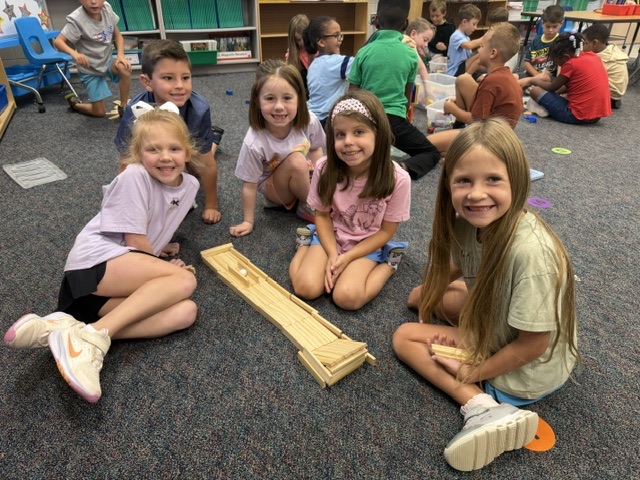 students building with blocks and STEM toys