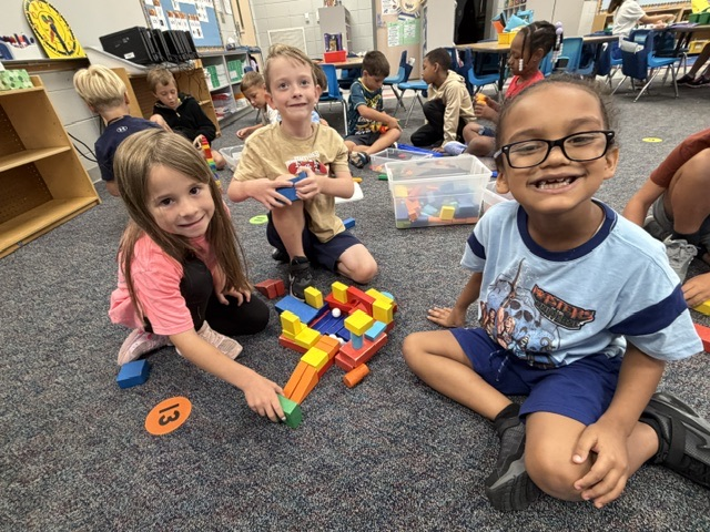 students building with blocks and STEM toys