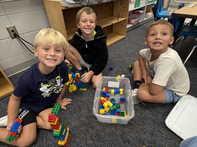 students building with blocks and STEM toys