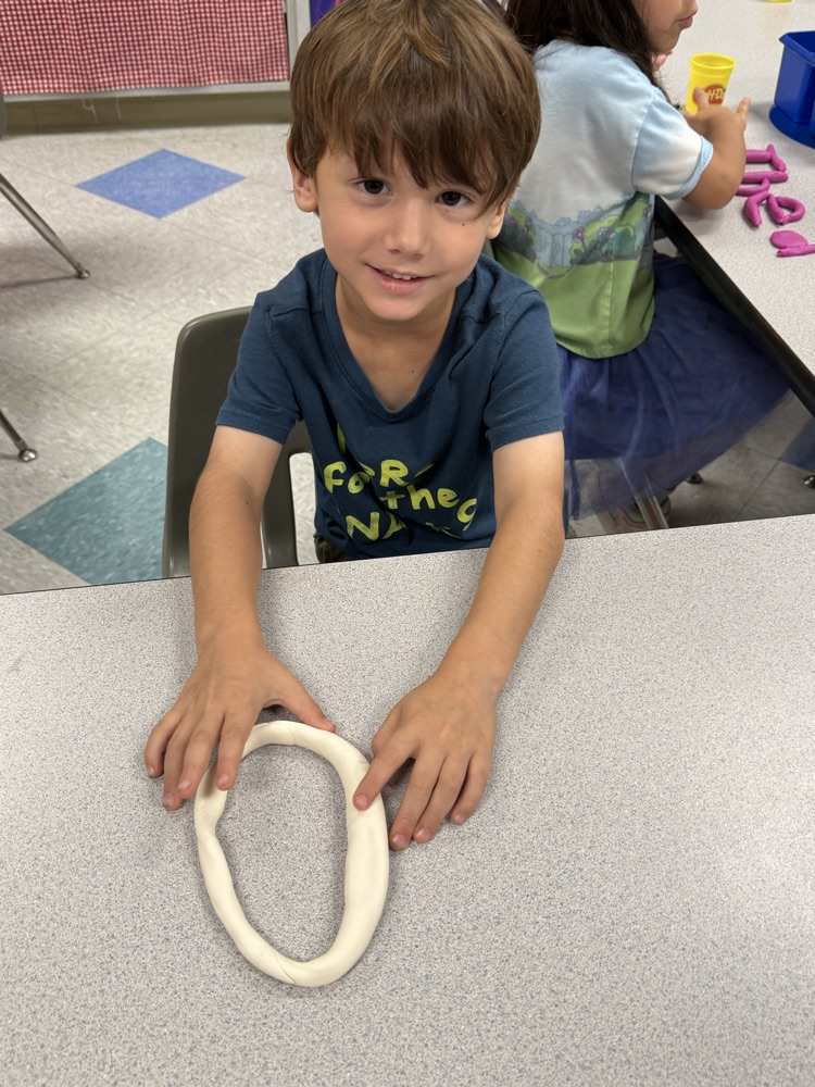 students making names with playdough 