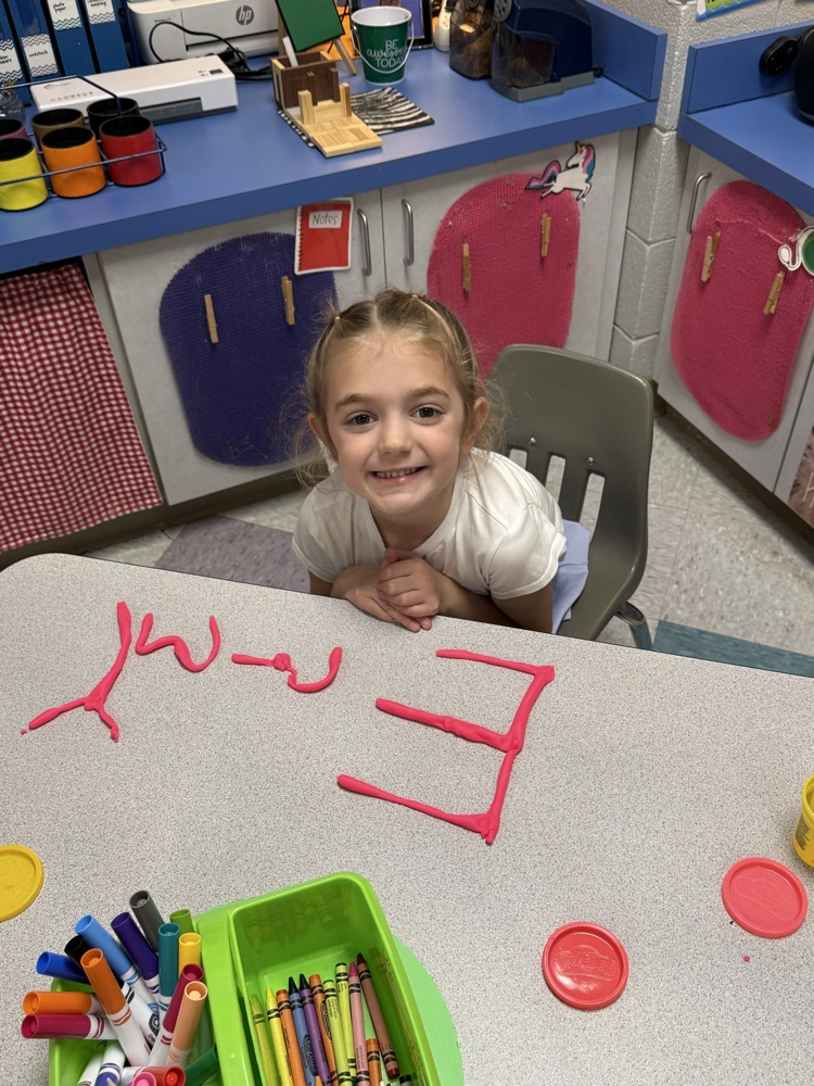 students making names with playdough 