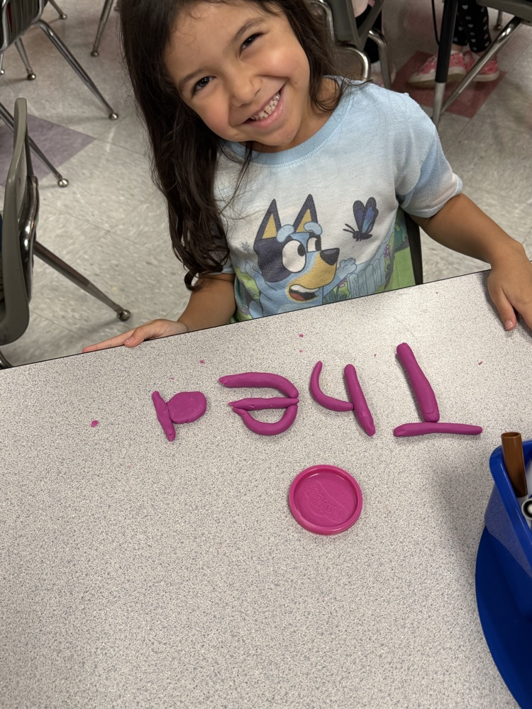 students making names with playdough 