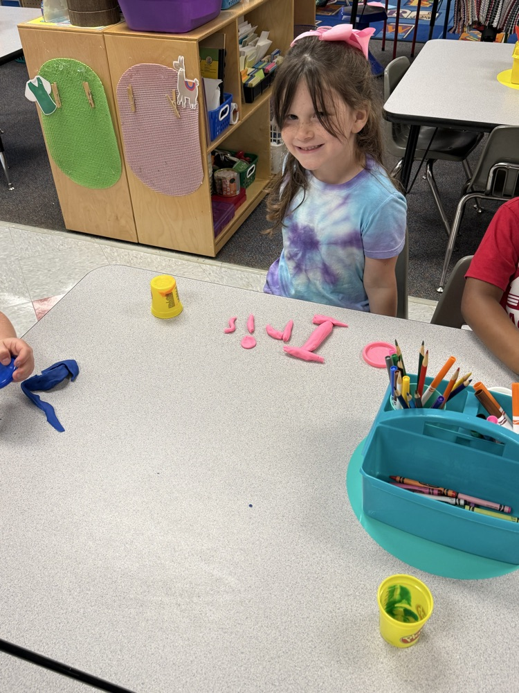students making names with playdough 